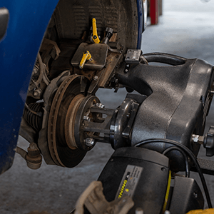 Autosmith technician servicing brakes
